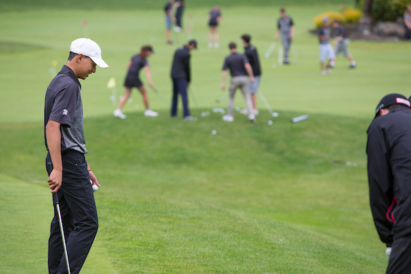 Players at chipping green